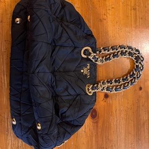 Like new black with gold accents Prada quilted handbag